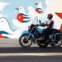 Velha moto a passar frente a novo mural da União de Jovens Comunistas (Abril 2011)