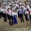 Coreia do Norte, 30.08.2011 | Moradores de Rason, a nordeste da capital norte-coreana, Pyongyang, participam numa cerimónia de despedida do primeiro cruzeiro turístico promovido pela Coreia do Norte em colaboração com a China. 
