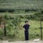 Um guarda da fronteira China - Coreia do Norte, em Wonjong-ri, Rason. 