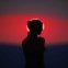 GRÉCIA, 15.03.2012. Uma réplica da estátua da deusa Afrodite de Milo sob um miraculoso pôr-do-sol visto da ilha de Santorini   