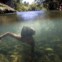 BRASIL, 25.07.2012. Uma criança de uma tribo indígena nada no rio de São Miguel, durante o XII Encontro de Culturas Tradicionais da Chapada dos Veadeiros