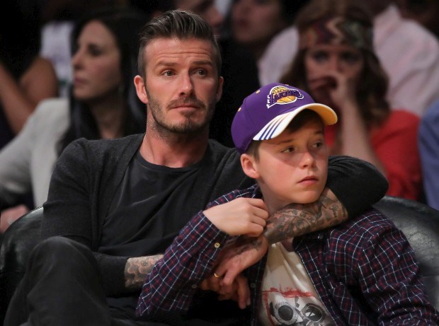 David Beckham com um dos filhos, Brooklyn