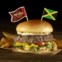 Jamaica: Jamaican Jerk Burger com hambúrguer coberto com creme de queijo e manga, acompanhado de jalapeños, anéis de banana picantes e maionese jerk