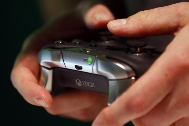 A man checks the new Xbox Elite Wireless Controller during the Gamescom 2015 fair in Cologne