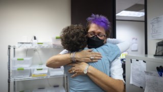 Clinic founder and director Kathy Kleinfeld hugs patient advocate Marjorie Eisen at the close of a long day at the Houston Women’s Reproductive Services clinic on Friday, June 24, 2022. The clinic will continue care for their patients but will no longer be able to perform abortions. MUST CREDIT: Photo for The Washington Post by Annie Mulligan. 