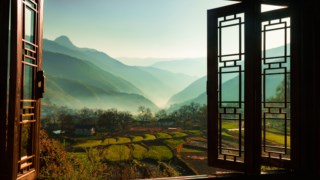 Upfront portfolio pic; Shangrila and Beyond -- The view from Songtsam Lodge in Tacheng, overlooks terraced rice paddies. The local farming community of Tibetans, Lisu, and Naxi Minorities have been working this valley for centuries, thanks to it’s mild climate and fertile soil.
