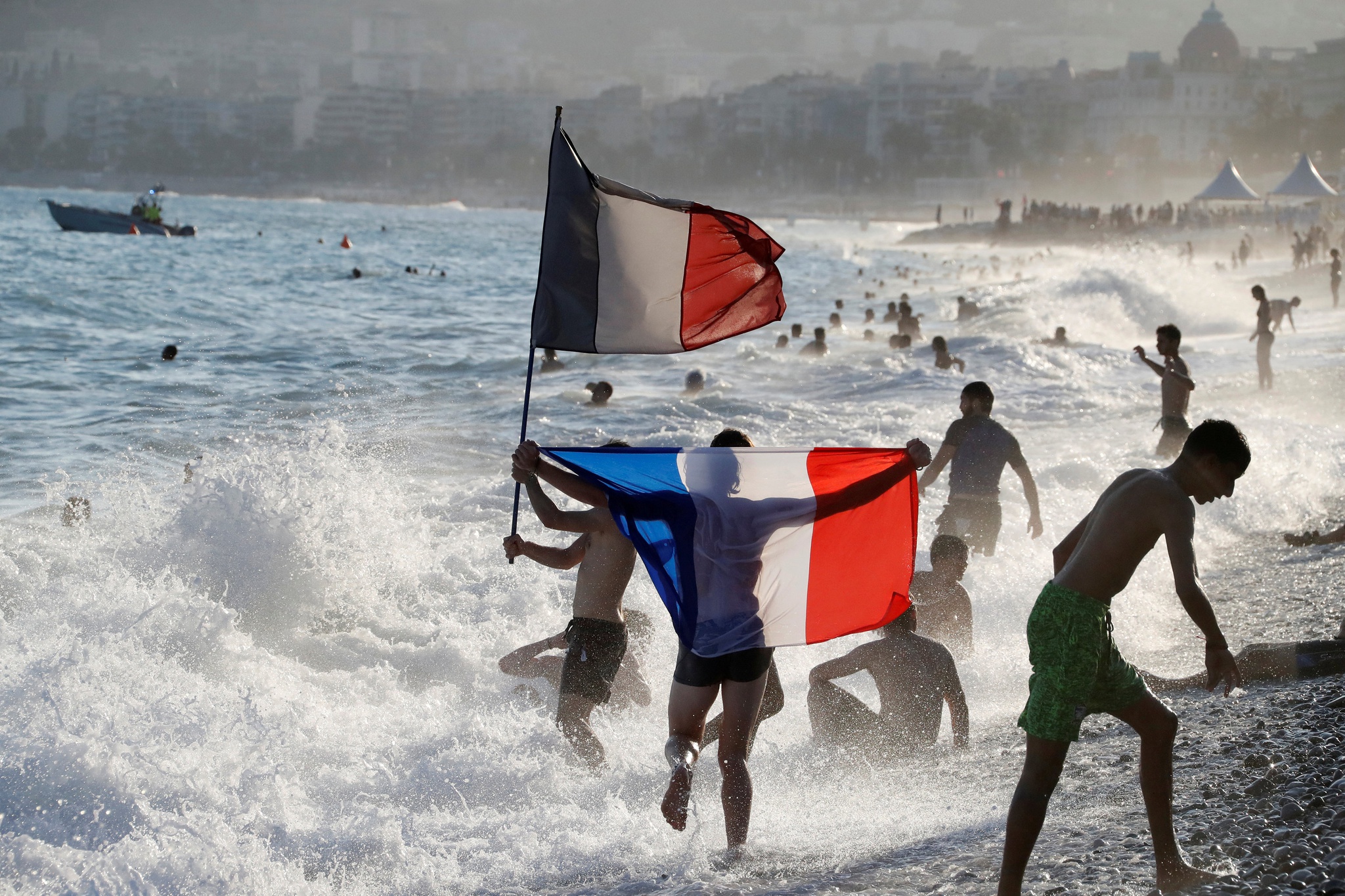 Soccer Football - World Cup - Final - France vs Croatia - Nice, France, July 15, 2018 - France fans celebrate on the beach after they defeated Croatia in their Soccer World Cup final match. REUTERS/Eric Gaillard TPX IMAGES OF THE DAY