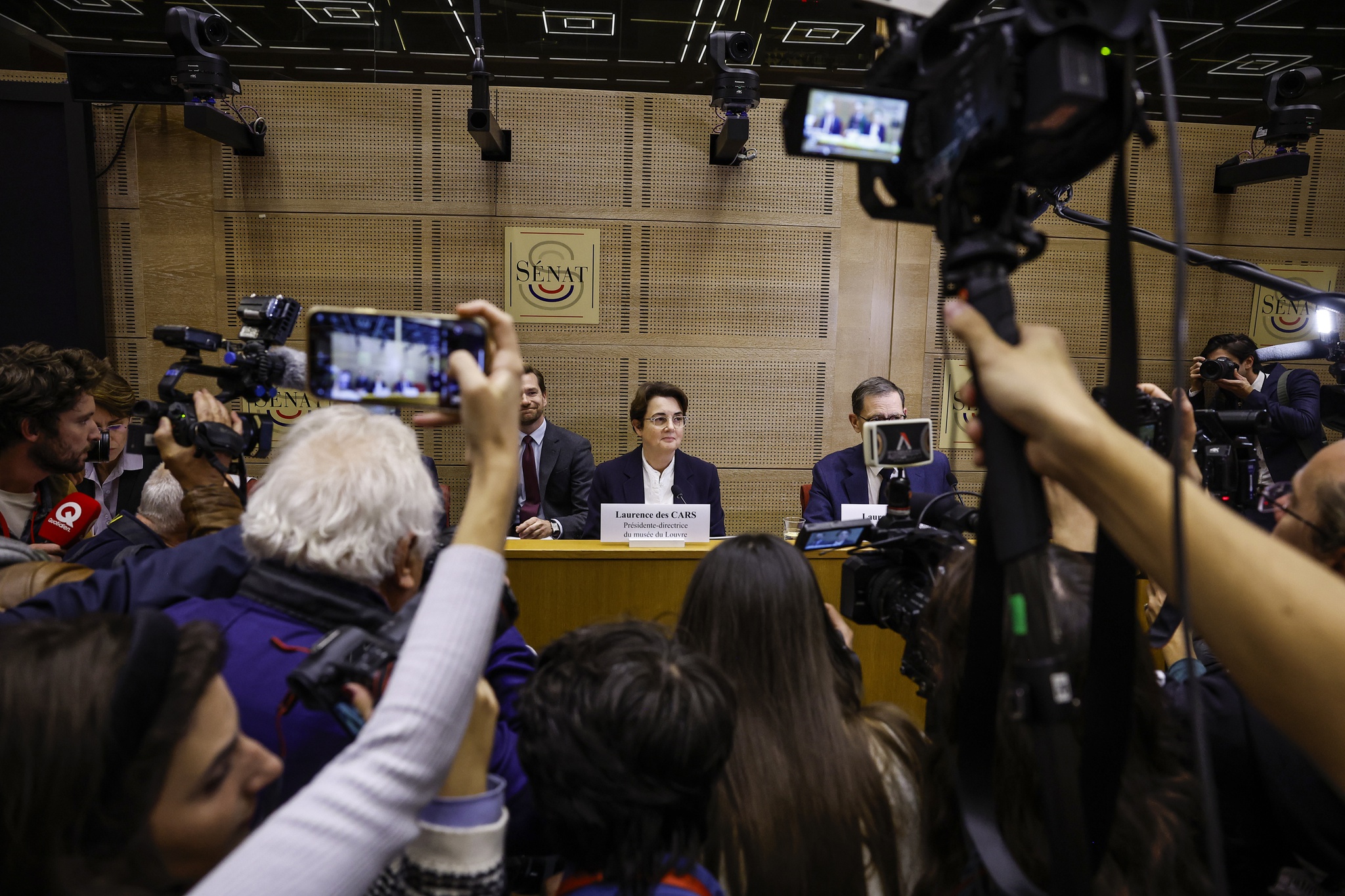 epa12472833 The president and director of the Louvre, Laurence des Cars (C) looks on prior to being questioned by senators following the spectacular burglary at the Louvre, at the French Senate in Paris, France, 22 October 2025. The Louvre Museum was targeted in a robbery by several criminals who smashed windows to steal eight priceless royal pieces of jewellery on 19 October. EPA/YOAN VALAT