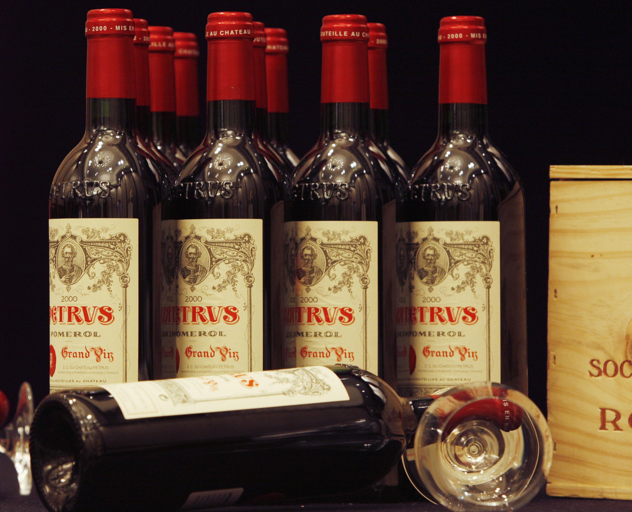 Bottles of 2000 Chateau Petrus are shown at a news conference ahead of an Acker Merrall & Condit wine auction in Hong Kong November 12, 2008. A case of 12 bottles are expected to fetch between $40,000 and $60,000 in the auction to be held on November 15, 2008. REUTERS/Bobby Yip (CHINA) - GM1E4BC18W001
0