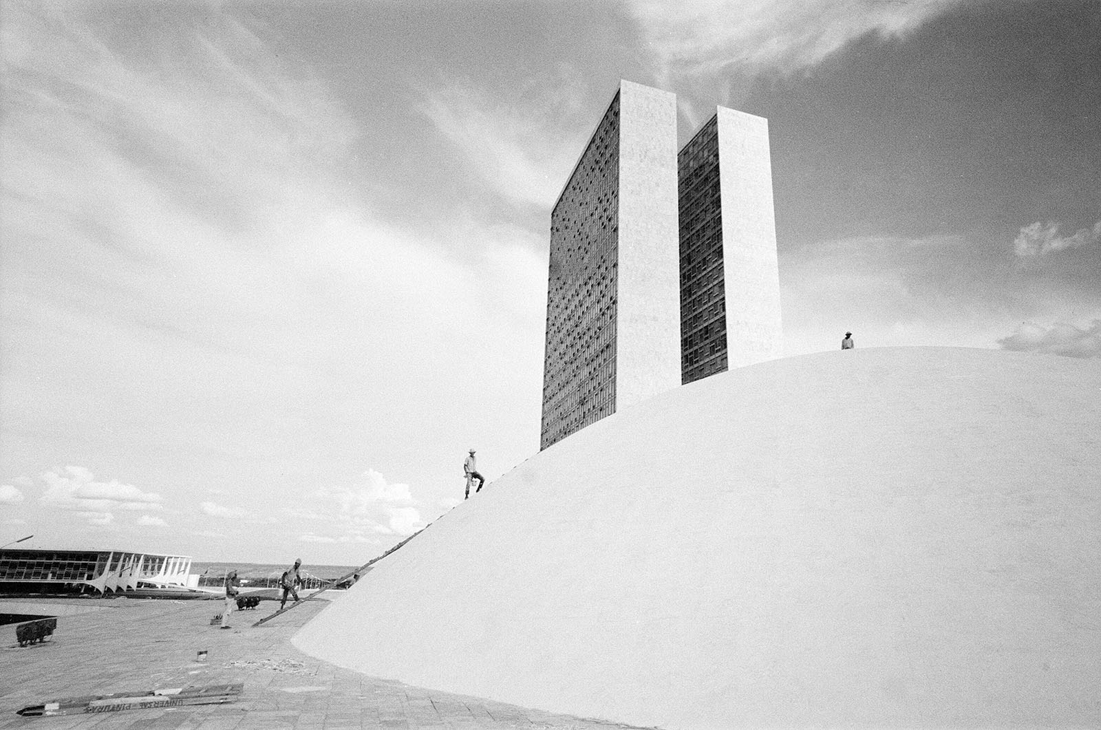 The palace of the National Congress, under construction, Brasilia, Brazil, 1st November 1968. Plaza of the Three Powers government buildings designed by Oscar Ribeiro de Almeida Niemeyer Soares Filho, known as Oscar Niemeyer. Rising above the flat roof, are two cupolas, which indicate the assembly chambers of Brazil's bicameral legislature. (Photo by Freddie Reed/Mirrorpix/Getty Images)