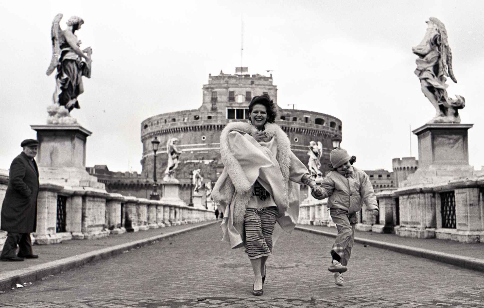Rome, Italy, Jan. 24, 1985. The Italian actress Claudia Cardinale with her daughter Claudine on the bridge of Castel Sant Angelo. ( Photo by Vittoriano Rastelli )