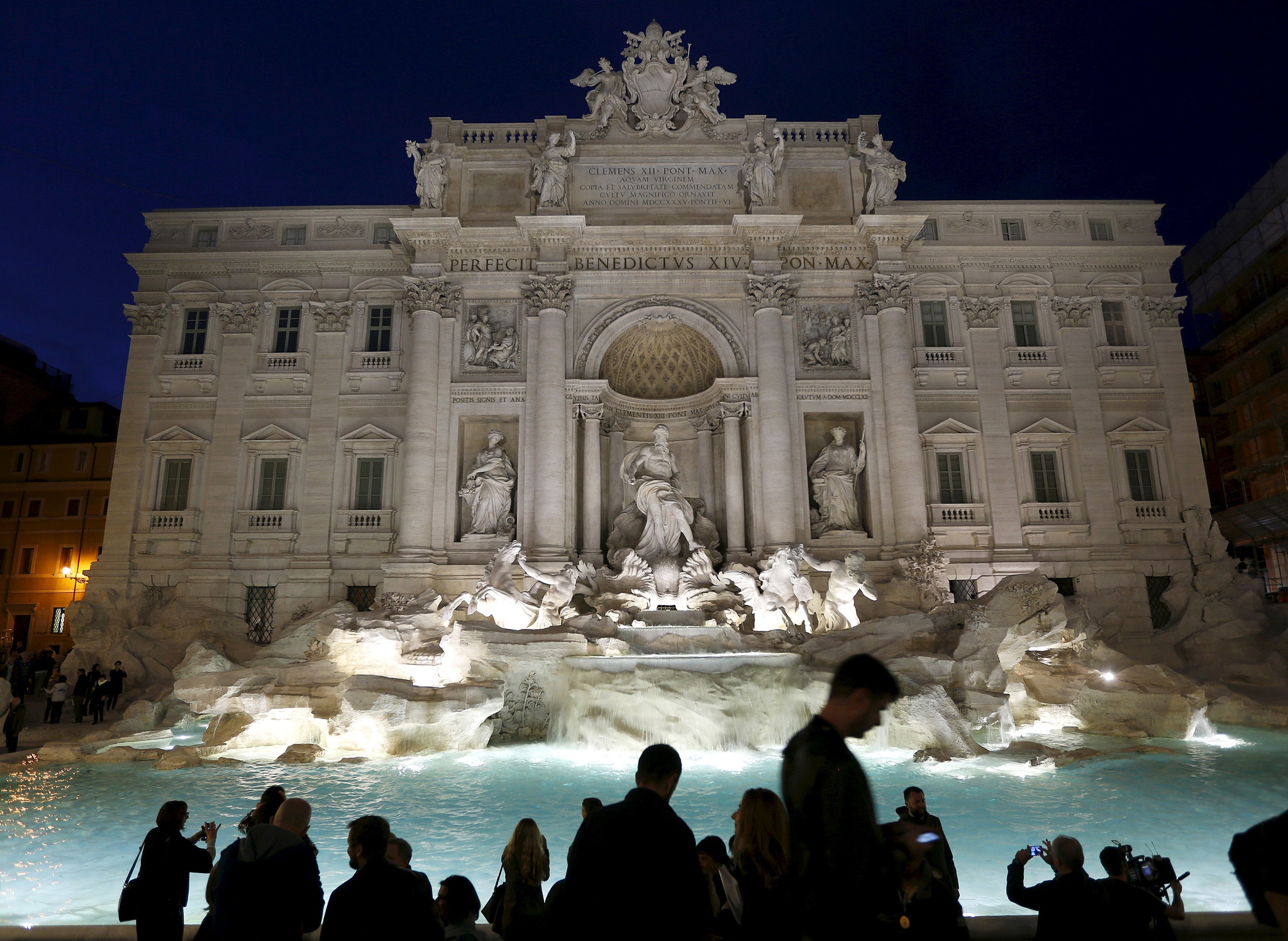 FILE PHOTO: People take pictures during an opening ceremony of Rome's Trevi Fountain after it is restored, November 3, 2015. REUTERS/Alessandro Bianchi/File Photo
NARCH/NARCH30