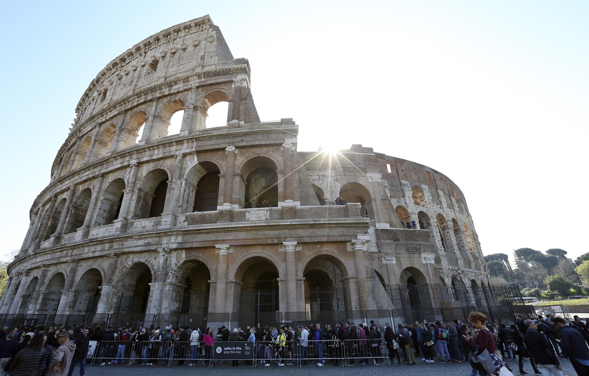 People stand in queue at the entrance of Rome's ancient Colosseum downtown Rome, Italy, March 17, 2016. REUTERS/Stefano Rellandini